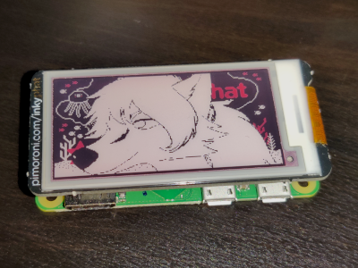 An eInk display attached to a Raspberry Pi Zero, displaying a character from Anthrotari