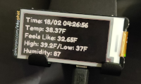 A photo of the eInk display showing the current time and weather